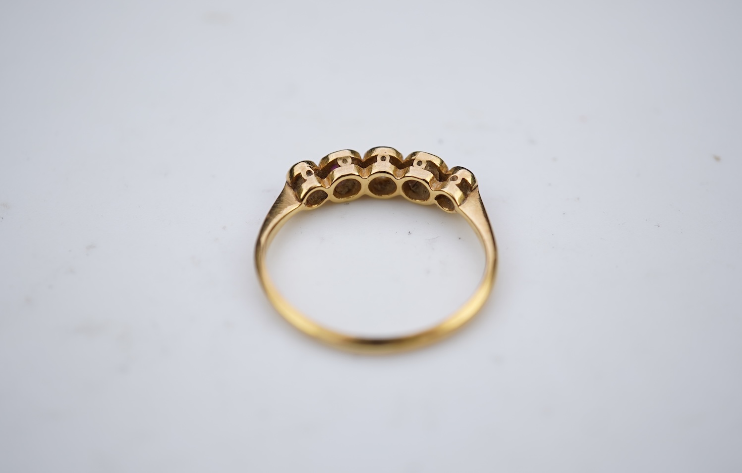 A ruby and diamond five-stone ring, early 20th century